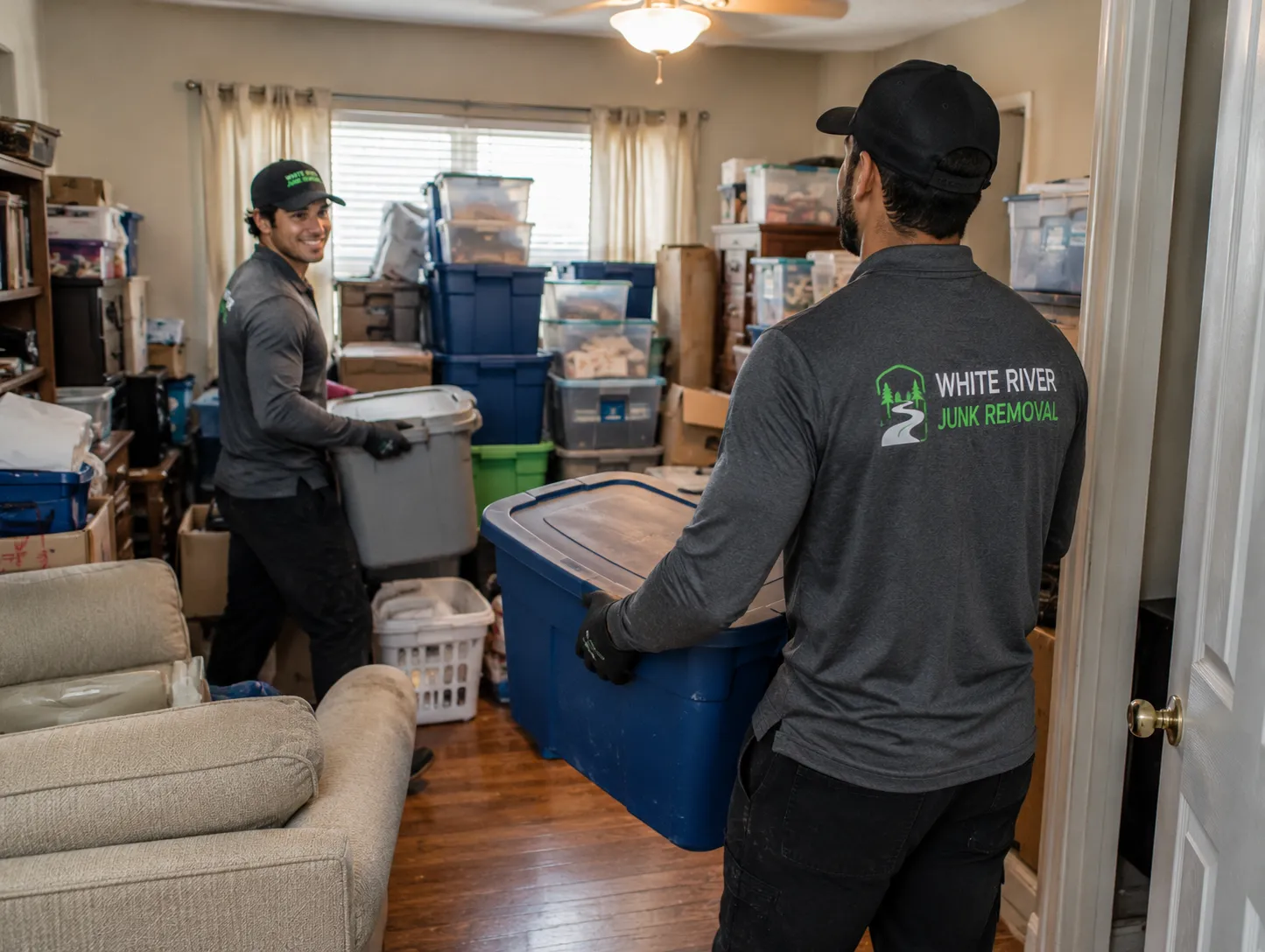 Boxes and storage totes being cleared from a home during a cleanout